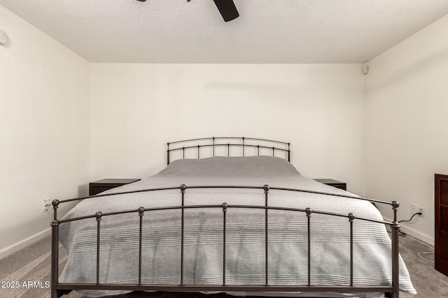 6426 W Lamar Rd, Glendale, AZ 85301 - unfurnished bedroom featuring carpet, baseboards, ceiling fan, and a textured ceiling