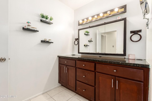 6426 W Lamar Rd, Glendale, AZ 85301 - bathroom with vanity, tile patterned flooring, and baseboards