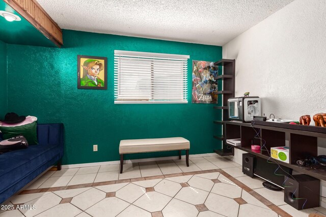 6426 W Lamar Rd, Glendale, AZ 85301 - living area featuring a textured ceiling, a textured wall, and tile patterned flooring