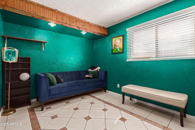 6426 W Lamar Rd, Glendale, AZ 85301 - sitting room featuring tile patterned flooring, a textured ceiling, and baseboards