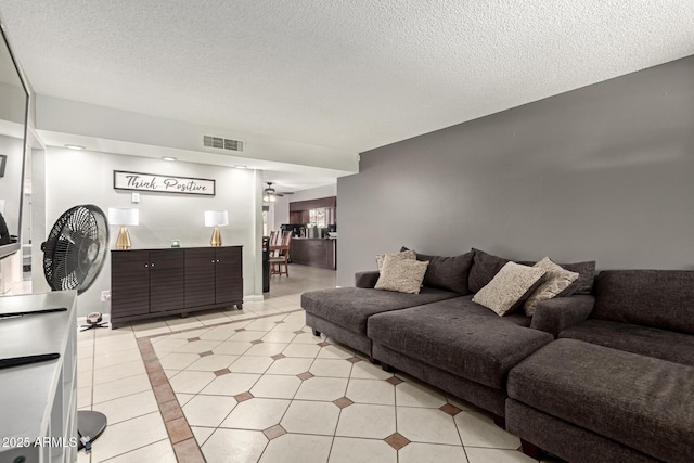 6426 W Lamar Rd, Glendale, AZ 85301 - living room with light tile patterned floors and a textured ceiling