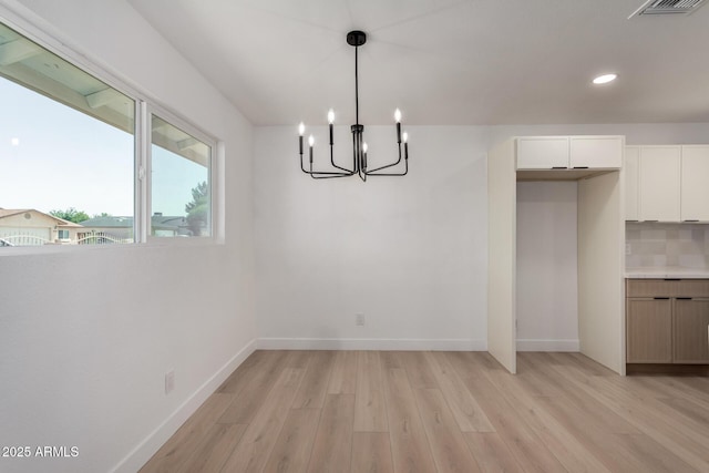 2443 E Randall Dr, Tempe, AZ 85288 - unfurnished dining area featuring light wood finished floors, a chandelier, baseboards, and recessed lighting