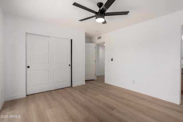 2443 E Randall Dr, Tempe, AZ 85288 - unfurnished bedroom with light wood finished floors, a closet, baseboards, and ceiling fan