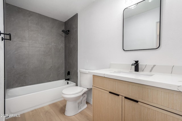 2443 E Randall Dr, Tempe, AZ 85288 - full bath featuring wood finished floors, toilet, vanity, and tub / shower combination