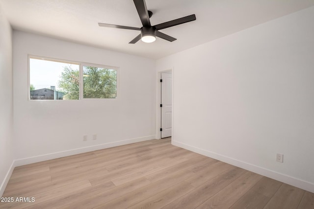 2443 E Randall Dr, Tempe, AZ 85288 - spare room featuring light wood-type flooring, ceiling fan, and baseboards