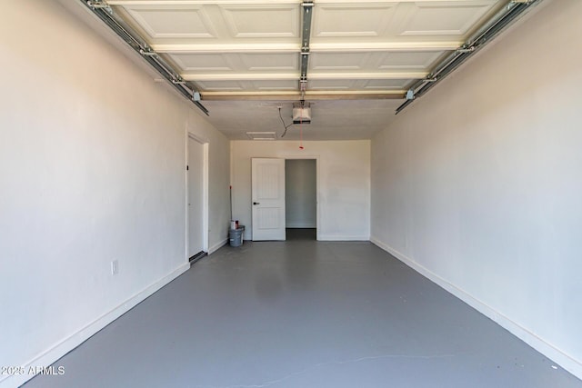 2443 E Randall Dr, Tempe, AZ 85288 - garage featuring a garage door opener and baseboards