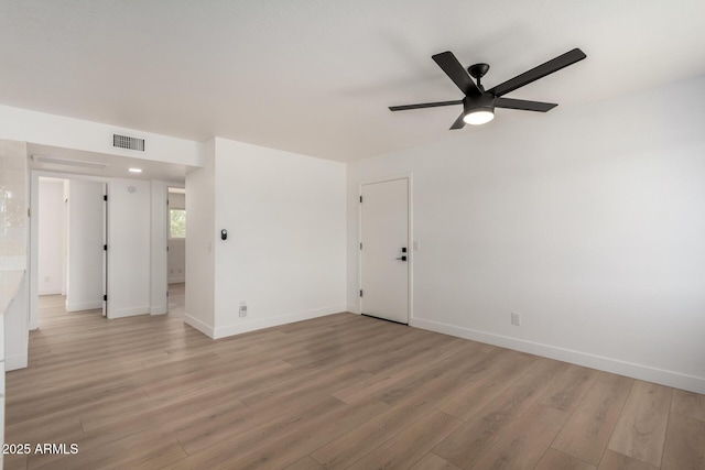 2443 E Randall Dr, Tempe, AZ 85288 - unfurnished room featuring light wood-style flooring, ceiling fan, and baseboards