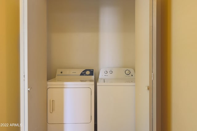 washroom featuring independent washer and dryer