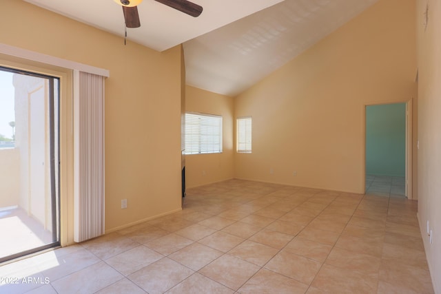 tiled spare room featuring ceiling fan and lofted ceiling