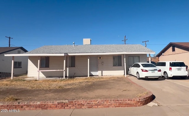 ranch-style house with a carport