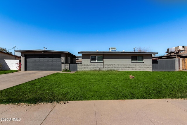 ranch-style house with a garage and a front yard