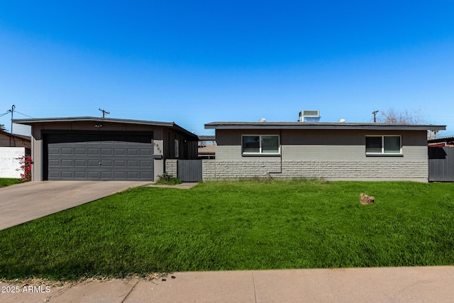 single story home with a garage and a front yard