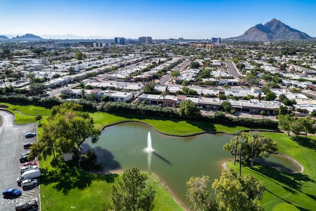 drone / aerial view featuring a water and mountain view