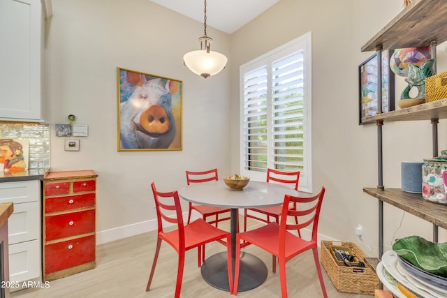 dining room with light hardwood / wood-style flooring