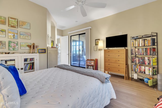 bedroom featuring light hardwood / wood-style flooring, a closet, and ceiling fan