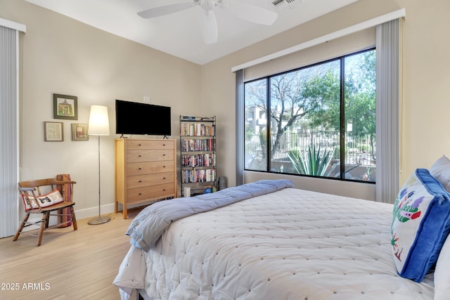 bedroom featuring hardwood / wood-style flooring and ceiling fan