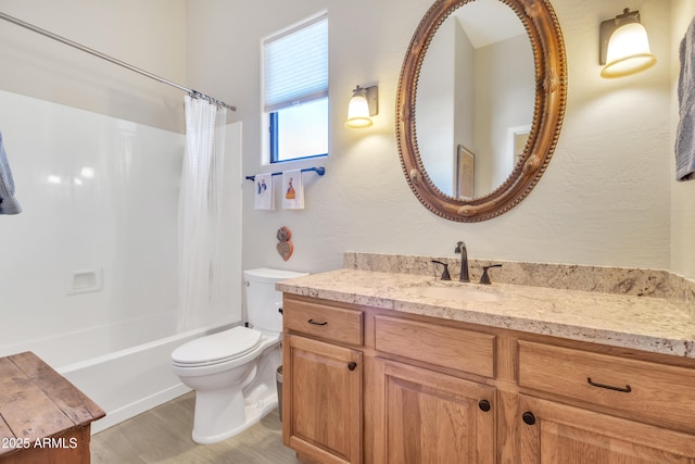 full bathroom featuring hardwood / wood-style flooring, vanity, shower / bathtub combination with curtain, and toilet