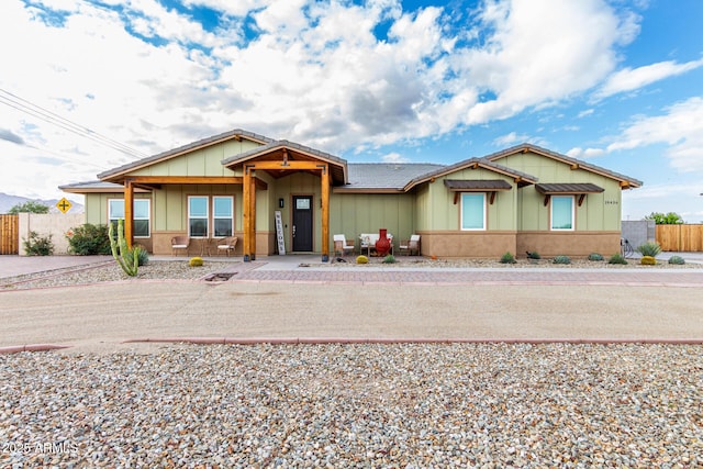 19436 W Windsor Ave, Buckeye, AZ 85396 - view of front facade featuring board and batten siding and fence