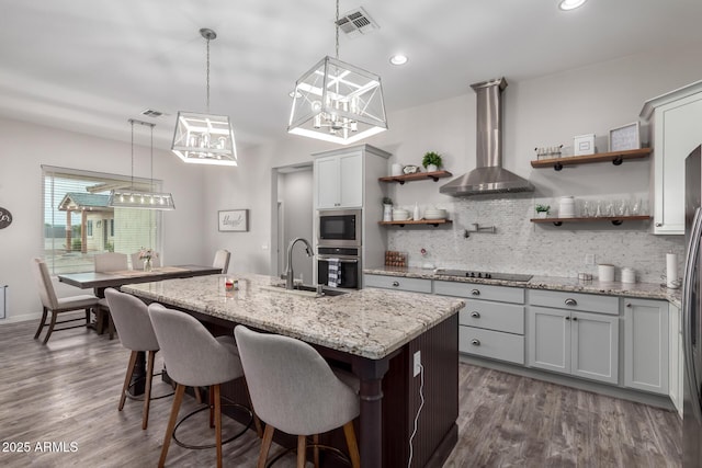 19436 W Windsor Ave, Buckeye, AZ 85396 - kitchen featuring wall chimney exhaust hood, open shelves, a sink, backsplash, and dark wood-type flooring