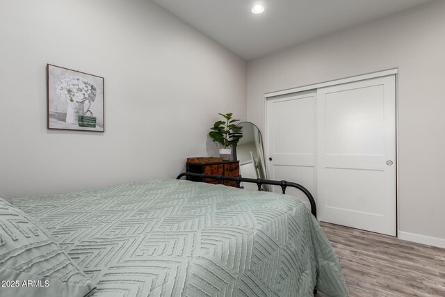 19436 W Windsor Ave, Buckeye, AZ 85396 - bedroom featuring light wood finished floors, a closet, recessed lighting, and baseboards