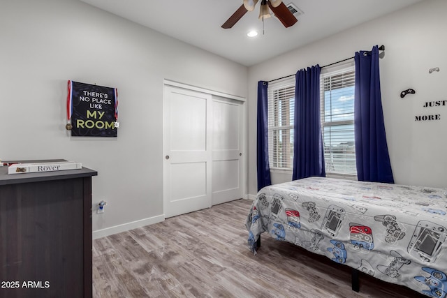 19436 W Windsor Ave, Buckeye, AZ 85396 - bedroom with baseboards, wood finished floors, a closet, a ceiling fan, and recessed lighting