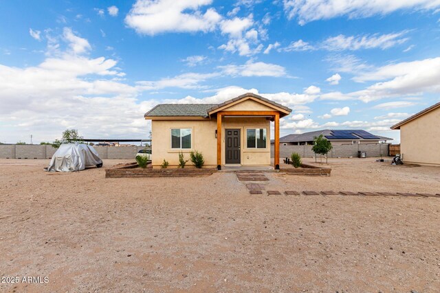 19436 W Windsor Ave, Buckeye, AZ 85396 - bungalow-style home with a fenced backyard, a tile roof, and stucco siding