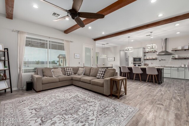 19436 W Windsor Ave, Buckeye, AZ 85396 - living room with beamed ceiling, light wood-style flooring, recessed lighting, and a ceiling fan