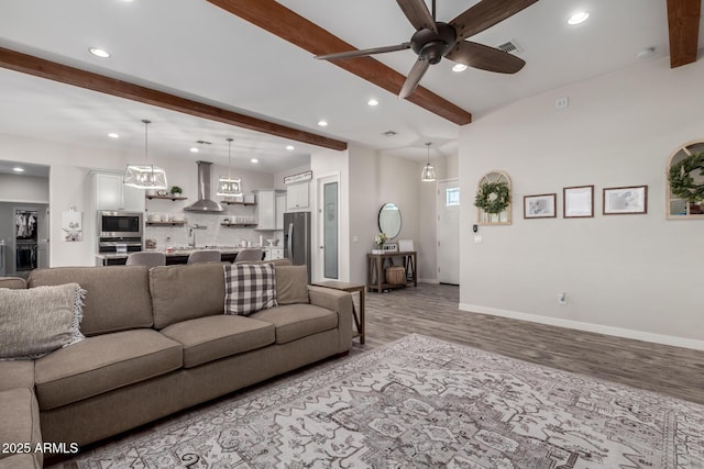 19436 W Windsor Ave, Buckeye, AZ 85396 - living area featuring beamed ceiling, light wood-style floors, recessed lighting, ceiling fan, and baseboards