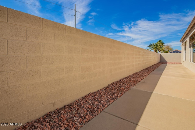 exterior space with a fenced backyard and a patio