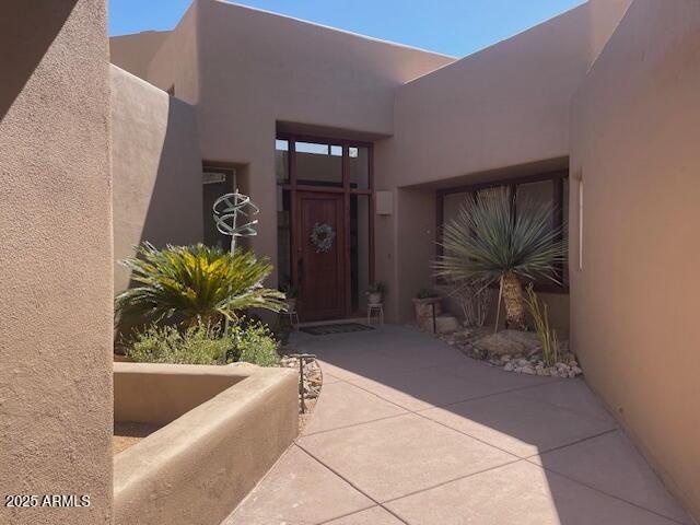 41576 N 107th Way, Scottsdale, AZ 85262 - doorway to property with stucco siding