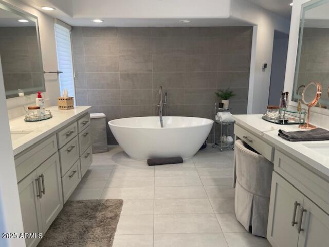 41576 N 107th Way, Scottsdale, AZ 85262 - bathroom featuring tile walls, tile patterned floors, vanity, a freestanding bath, and recessed lighting
