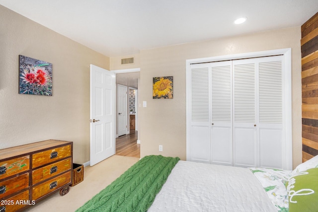 carpeted bedroom featuring a closet