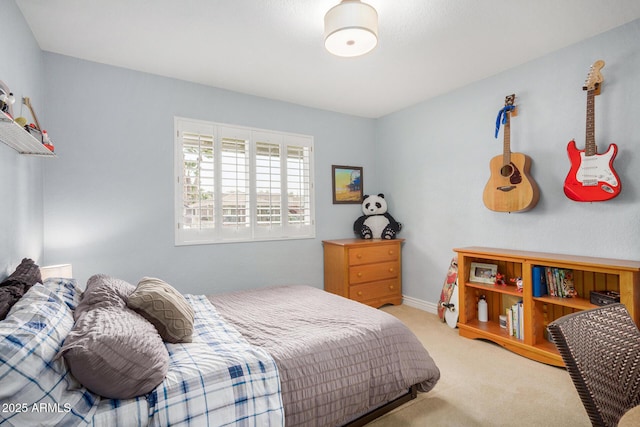 bedroom featuring light colored carpet