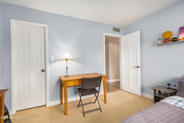 bedroom featuring light colored carpet