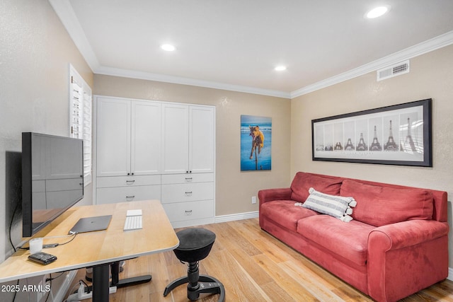 office area featuring ornamental molding and light hardwood / wood-style floors