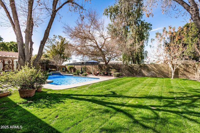 view of pool with a lawn, a patio area, a gazebo, and pool water feature