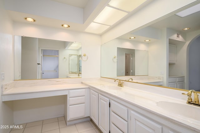 bathroom with tile patterned floors and vanity