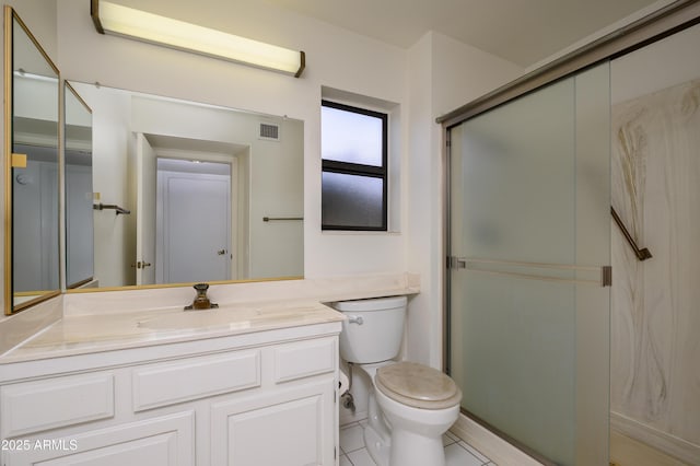 bathroom with vanity, toilet, and a shower with shower door