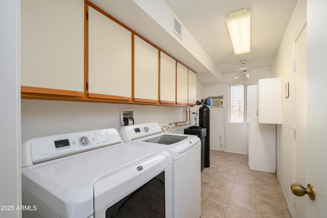 laundry room with light tile patterned flooring, cabinets, ceiling fan, and washing machine and dryer