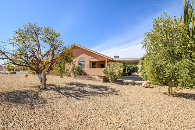 view of front of house featuring a carport