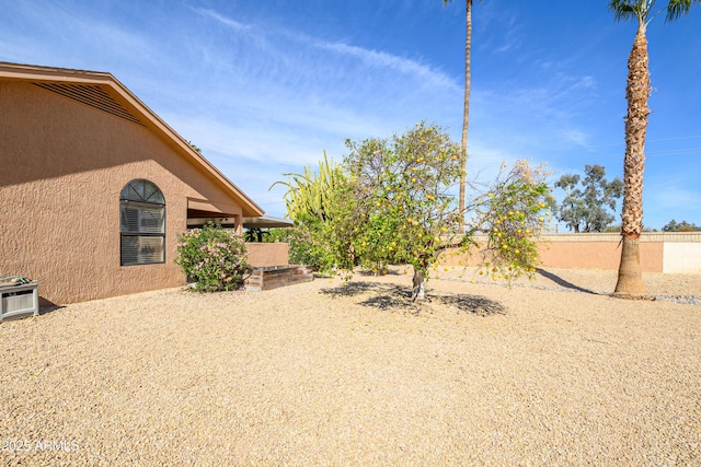 view of yard featuring a patio and central air condition unit