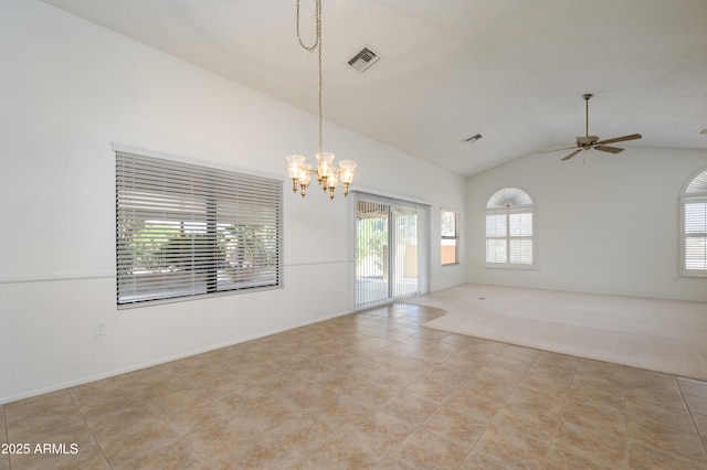 carpeted spare room featuring ceiling fan with notable chandelier and high vaulted ceiling