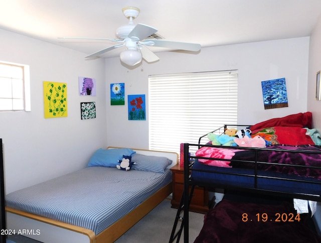 carpeted bedroom featuring ceiling fan