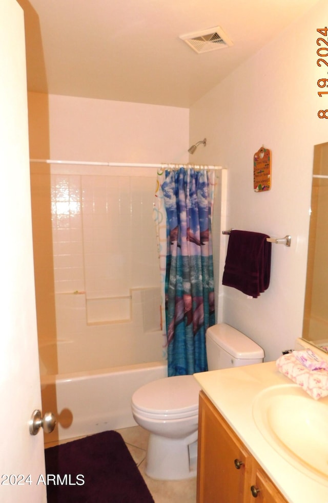 full bathroom featuring shower / bath combo, tile patterned floors, vanity, and toilet