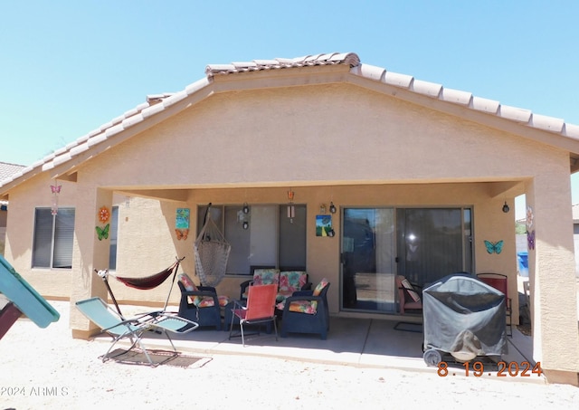 rear view of property with a patio area