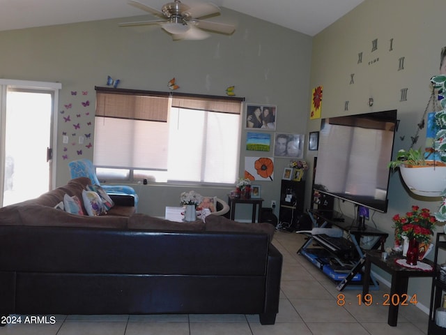 tiled living room with ceiling fan and lofted ceiling