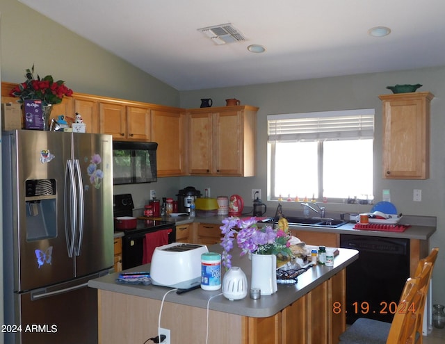 kitchen with a kitchen island, lofted ceiling, sink, and black appliances