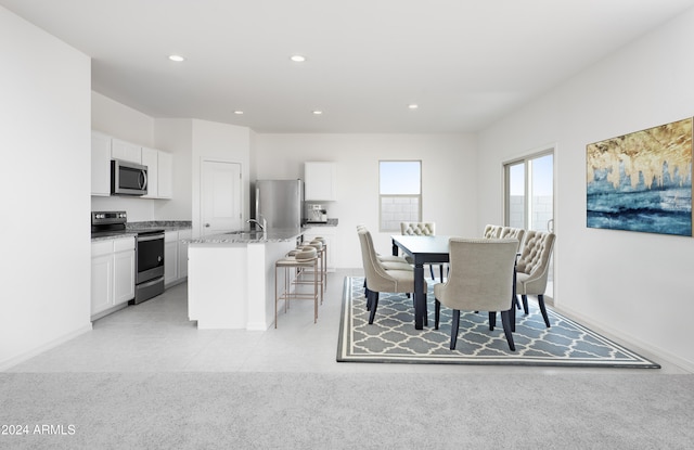 view of carpeted dining area