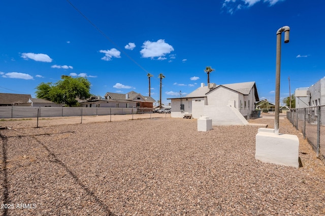 view of yard featuring fence and a residential view