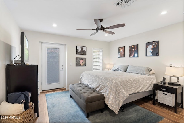 bedroom with recessed lighting, visible vents, wood finished floors, and a ceiling fan